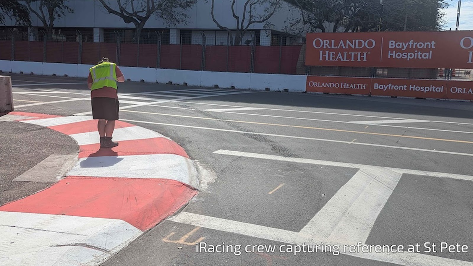 Image of man from iRacing crew standing on track